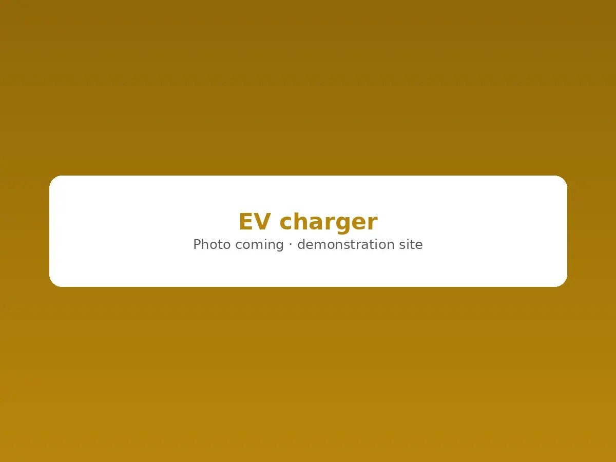 Level 2 EV charger mounted in a garage, plugged into a car